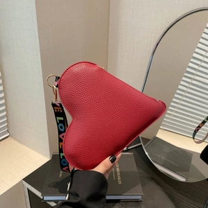 Red heart-shaped handbag with litchi texture and LOVE printed ribbon strap for women