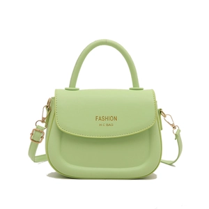 Minimalist mint green saddle bag with gold logo and adjustable shoulder strap