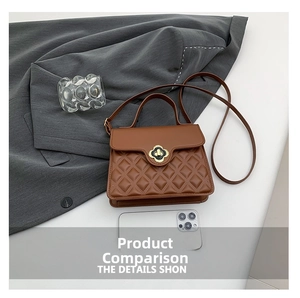 Macro detail of caramel quilted leather handbag with gold flower-shaped metal clasp