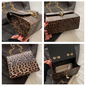 Detail view of leopard print crossbody bag with gold chain and metal lock closure