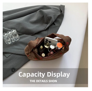 Brown corduroy shoulder bag interior view showing large capacity for phone and cosmetics