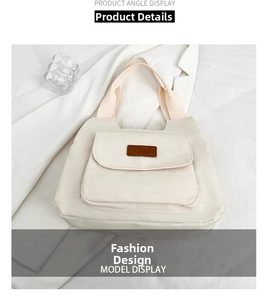 Detail of off-white canvas tote bag featuring a front pocket with brown fashion logo patch