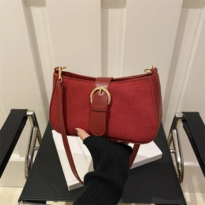 Minimalist red suede and leather underarm shoulder bag with golden buckle buckle detail