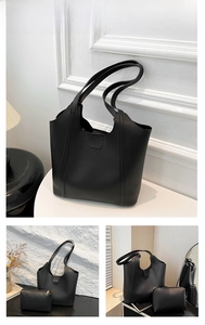 Detail view of black PU leather tote bag set including a matching zipper pouch