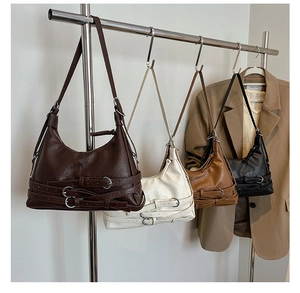 Detail view of multi-color retro Hobo bags featuring unique bottom buckle strap accents