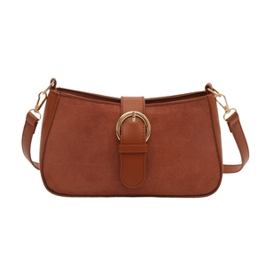 Retro brown suede underarm bag with gold buckle and smooth leather trim on white background