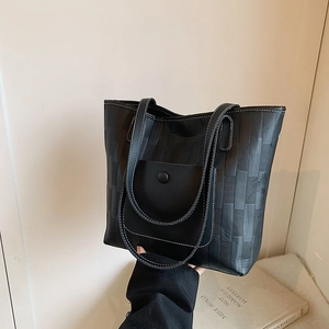 Black woven textured tote bag with contrast stitching and large capacity for daily use