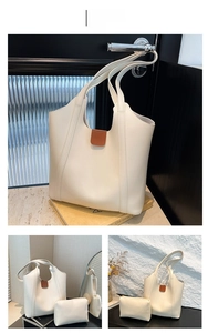 Detailed view of white minimalist faux leather tote bag set with matching inner pouch