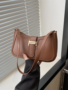 Brown vintage faux leather baguette bag with gold H buckle and sleek half-moon shape