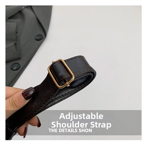 Close-up of adjustable dark brown leather tote strap with golden metal buckle and texture