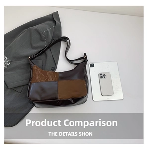 Detail of hobo tote bag in brown patchwork faux leather with office accessories