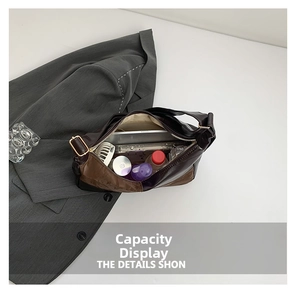 Top view showing the large internal capacity of the brown crescent tote with daily essentials