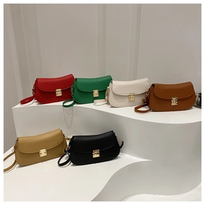 Close-up of leather saddle bags in six colors with gold metal buckle closure