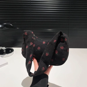 Black corduroy shoulder bag with red strawberry embroidery and top zipper closure
