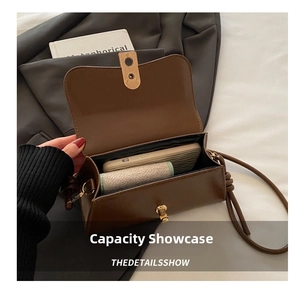 Internal capacity of brown vintage shoulder bag showing space for phone and wallet