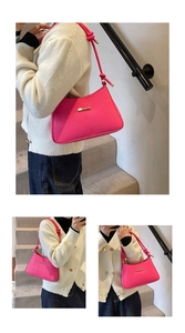Detail of rose pink faux leather handbag featuring fine animal texture and gold hardware