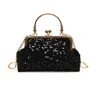 Sac coquille à paillettes noires avec poignée dorée et bandoulière pour soirée