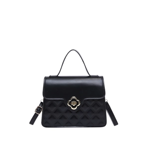 French style black square handbag with golden flower buckle and quilted leather texture
