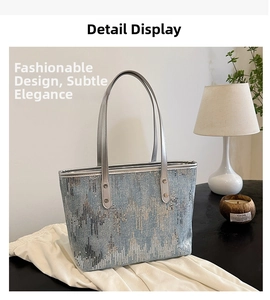 Close-up of sequined tote bag with blue and silver wave pattern and shiny PU leather straps