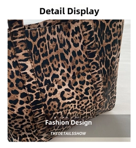 Close-up of leopard print pattern and faux leather texture on fashionable tote bag