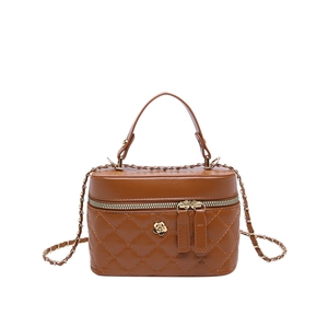 Brown quilted leather mini box bag with gold flower emblem and chain strap