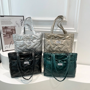 Quilted down tote bags in silver, bronze, black, and green with metallic finish
