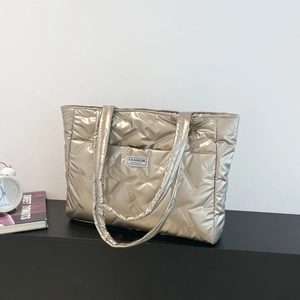 Champagne gold quilted down tote bag with metallic finish and Fashion Instinct label