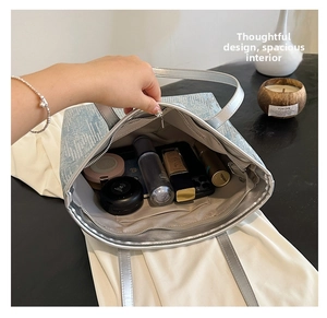 Top view of sparkling sequin tote bag showing spacious interior with cosmetics and essentials