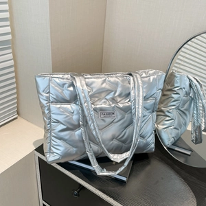 Silver quilted down tote bag with metallic finish and Fashion Instinct woven label