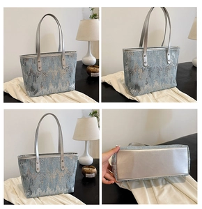 Detail view of large sequin tote bag with silver glitter patterns and faux leather handles