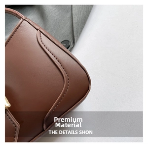 Close-up of premium brown leather texture and precise stitching on stylish shoulder bag