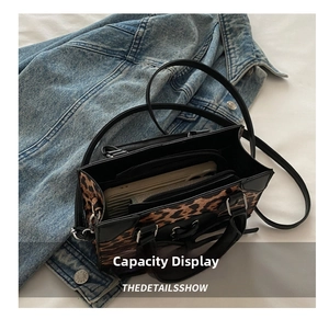 Macro shot of the leopard print crossbody bag showing large capacity for smartphones