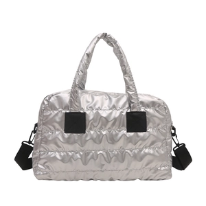 Silver quilted padded tote bag with black strap and metallic puffer texture