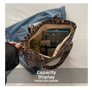 Internal view of a leopard print tote bag showing large capacity for daily items