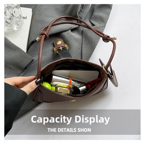 Interior view showing the capacity of a brown crescent shoulder bag for daily essentials