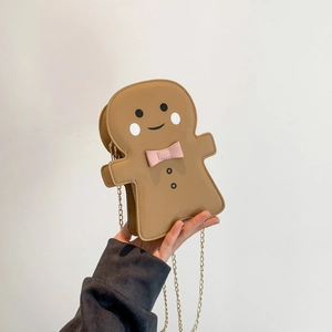 Gingerbread man crossbody bag with pink bow, golden chain strap and PU leather finish