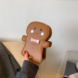 Cute gingerbread man crossbody bag with pink bow and gold chain strap in brown