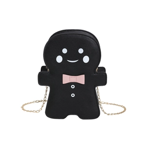 Cute gingerbread man shaped crossbody bag in black leather with pink bow and gold chain