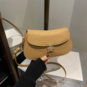 Chic mustard yellow cross-body bag with litchi grain texture and gold metal buckle