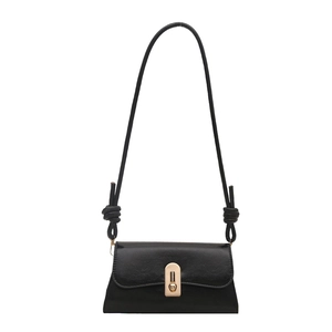 Classic black leather crossbody bag with gold metallic clasp and knotted strap detail