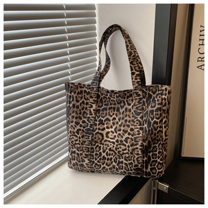 Close-up of leopard print tote bag with large capacity and durable double handles