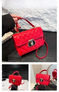 Detail of red quilted crossbody bag with metal twist lock and top handle