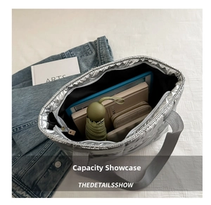 Interior view of spacious silver quilted tote bag showing ample storage for daily essentials