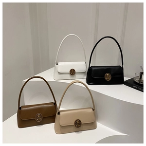 Group shot of retro shoulder bags with large oval bronze relief buckles in four colors