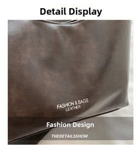 Detailed close-up of dark brown lychee texture leather with white fashion logo lettering