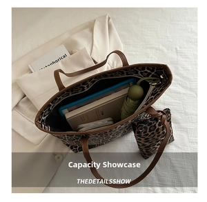 Spacious leopard print tote bag interior showing capacity for tablet, books and umbrella