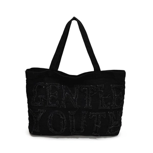 Large black denim tote bag featuring frayed Gentle Youth embroidery for high street fashion