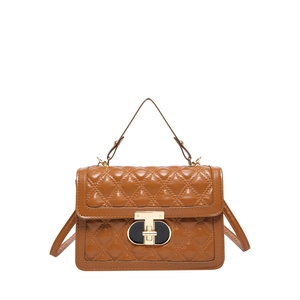 Caramel quilted leather crossbody bag with metallic turn-lock and top handle