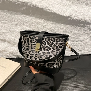 Retro leopard print bucket bag with black leather trim and golden metal clasp for women
