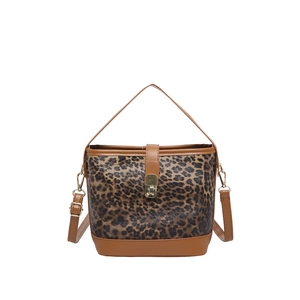 Retro leopard print bucket bag with brown leather trim and golden hardware